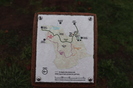 Map of trail capped on directional signage post